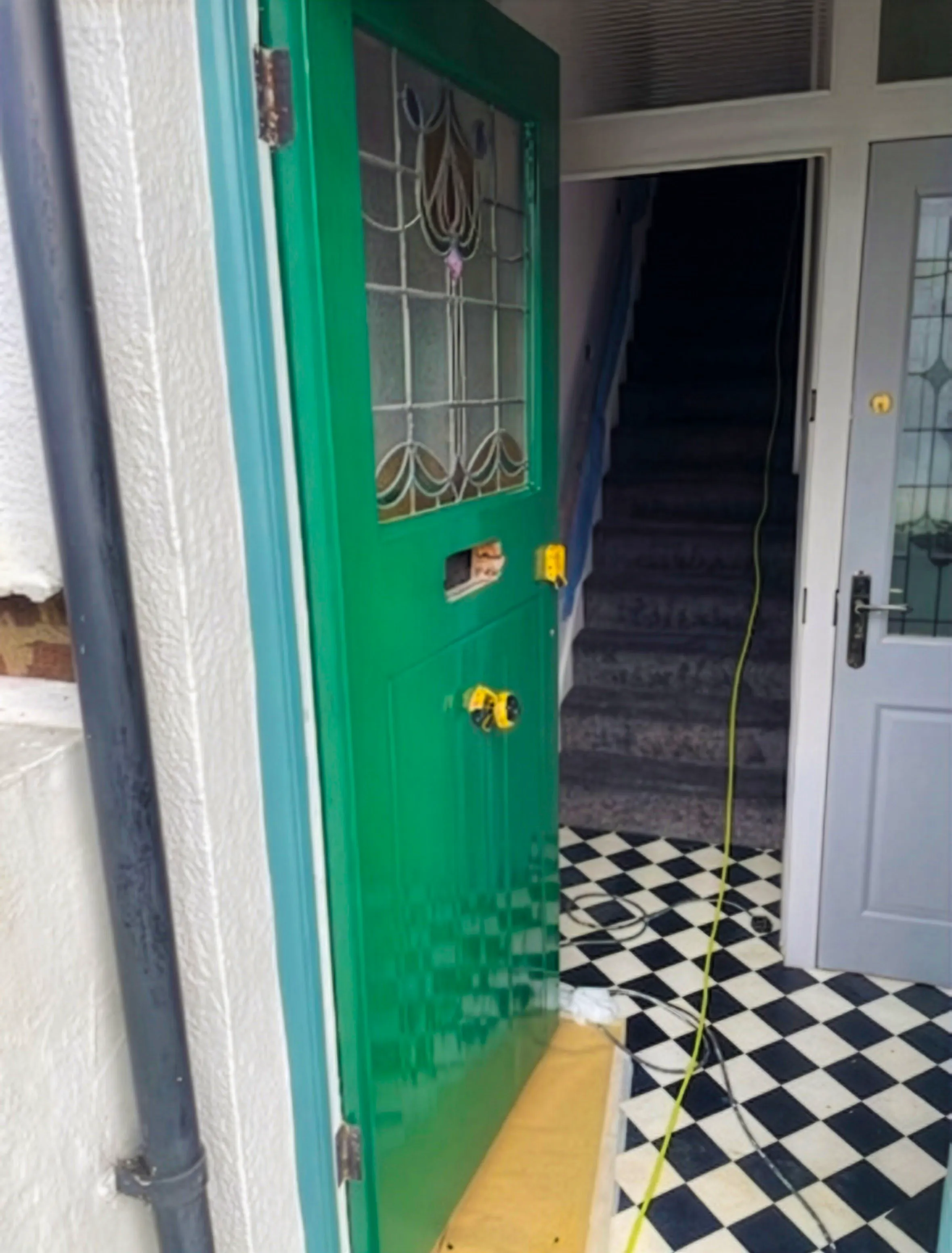 Exterior front door professionally painted in gloss green in Leigh-on-Sea