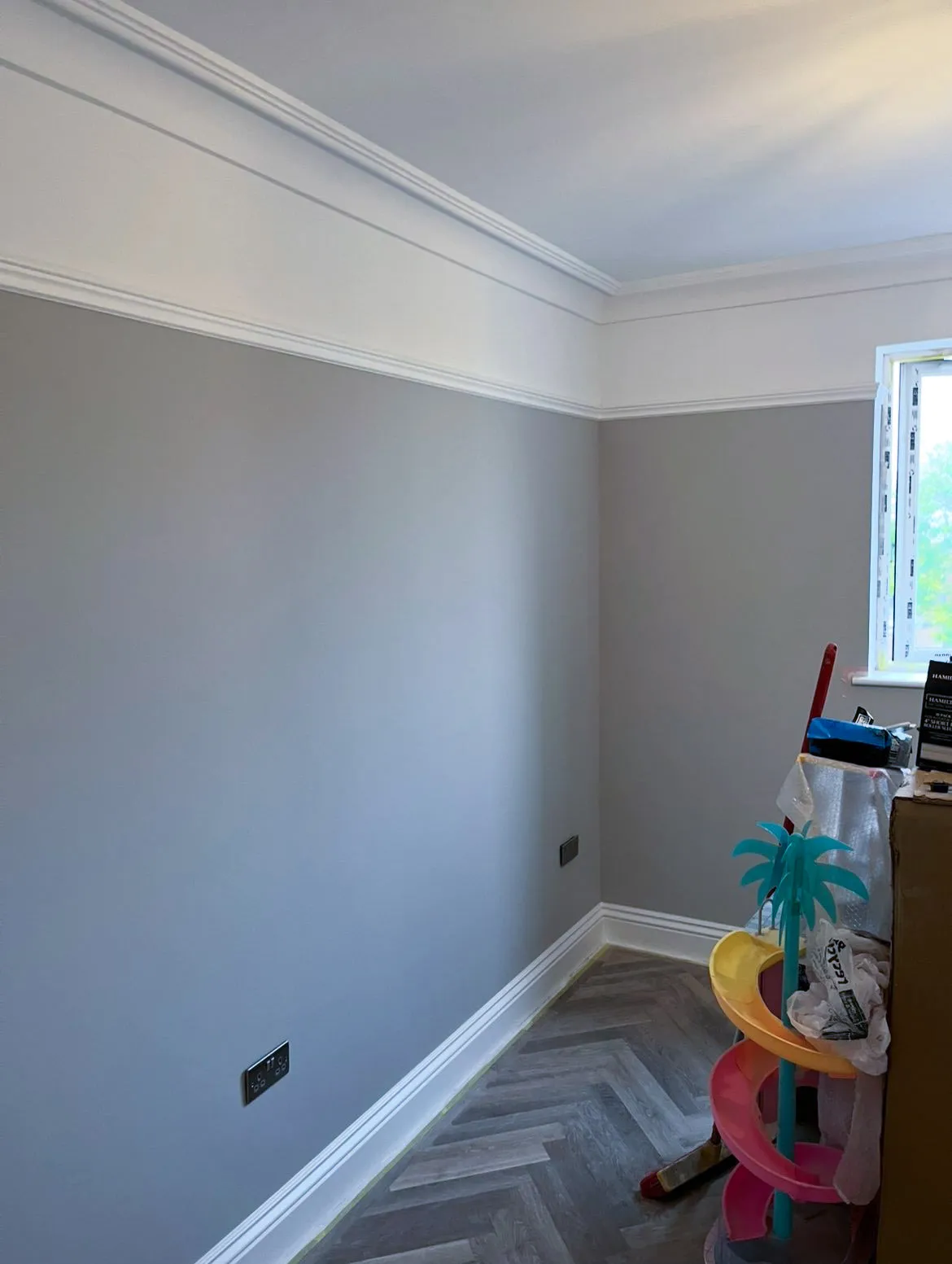 Freshly painted front room with crisp white trim and grey walls in Essex