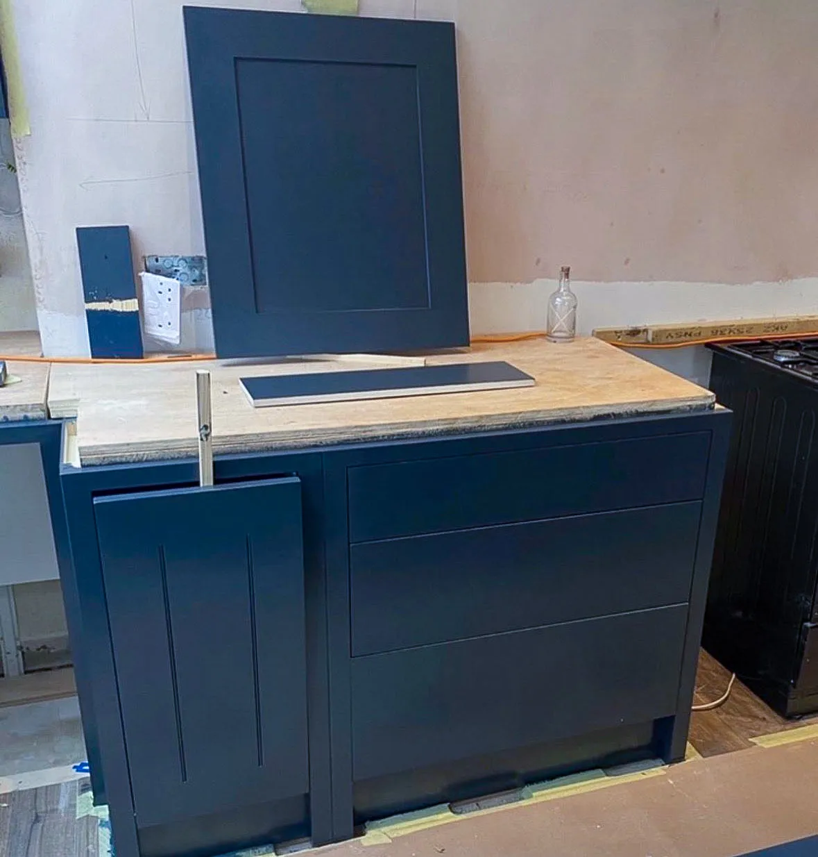 Custom furniture and cabinet respraying process in navy blue