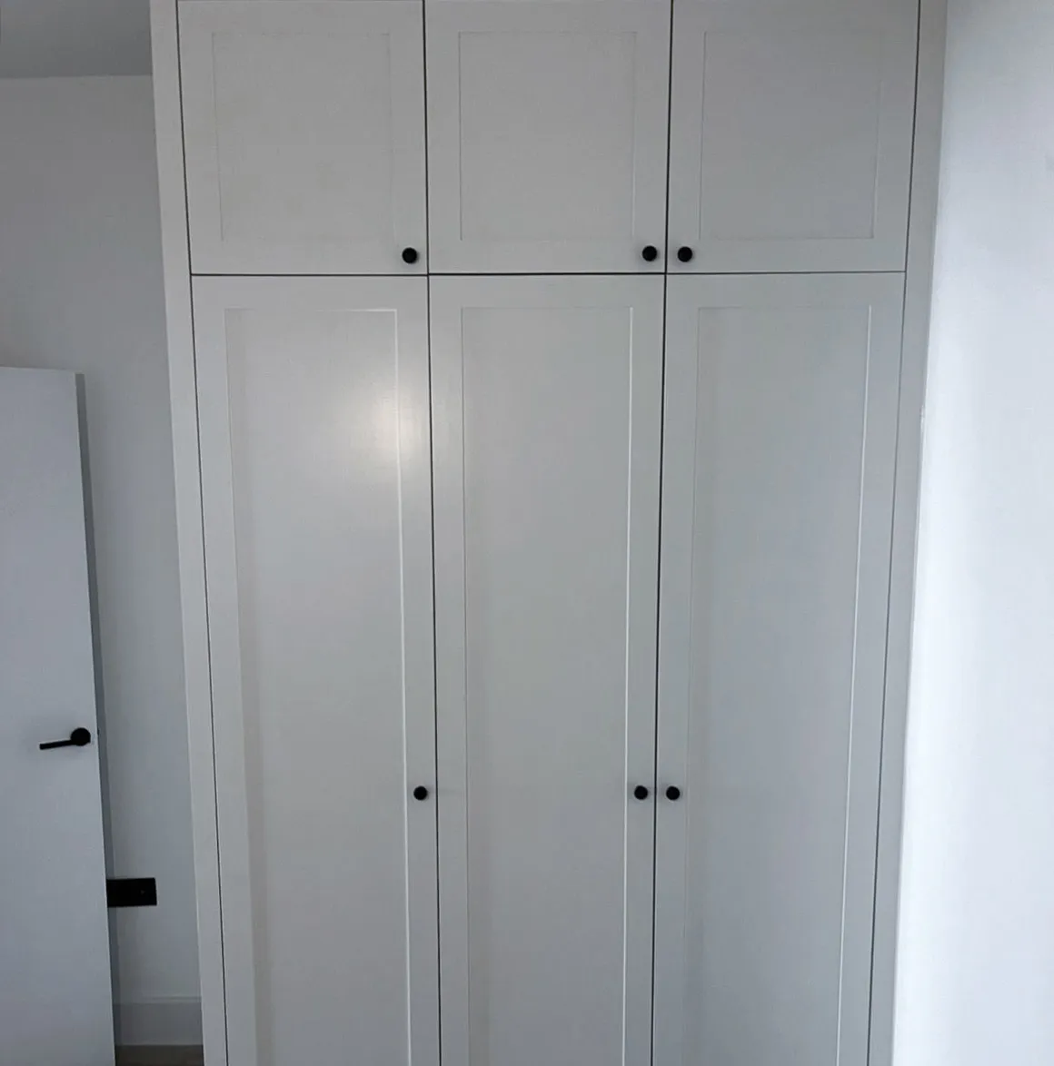 Fitted wardrobe doors professionally spray painted in crisp white