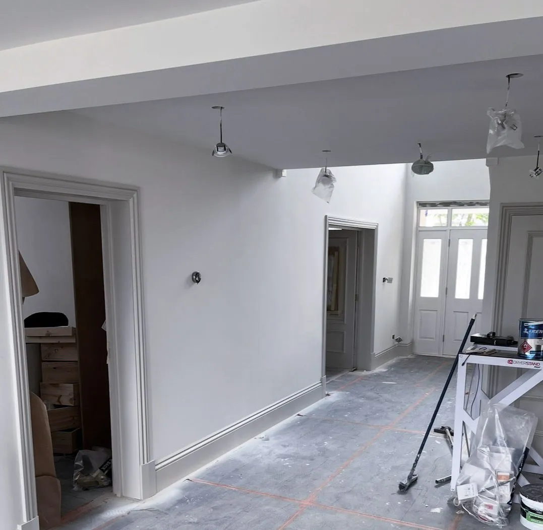 Bright, freshly decorated home hallway and woodwork in Essex