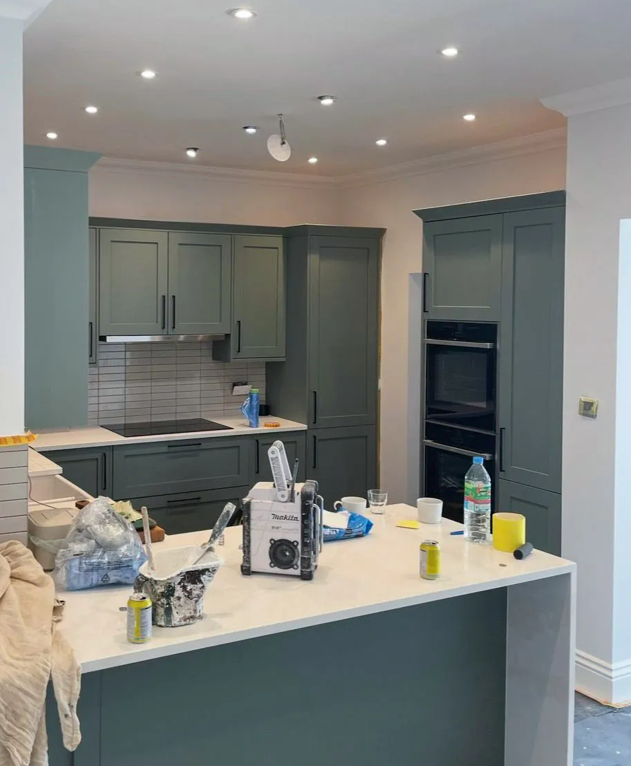 Professional kitchen respray in sage green with modern fixtures in Southend