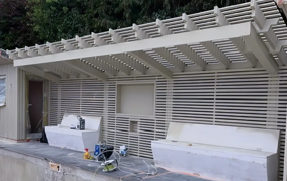 Exterior wooden pergola and seating area preparation for painting