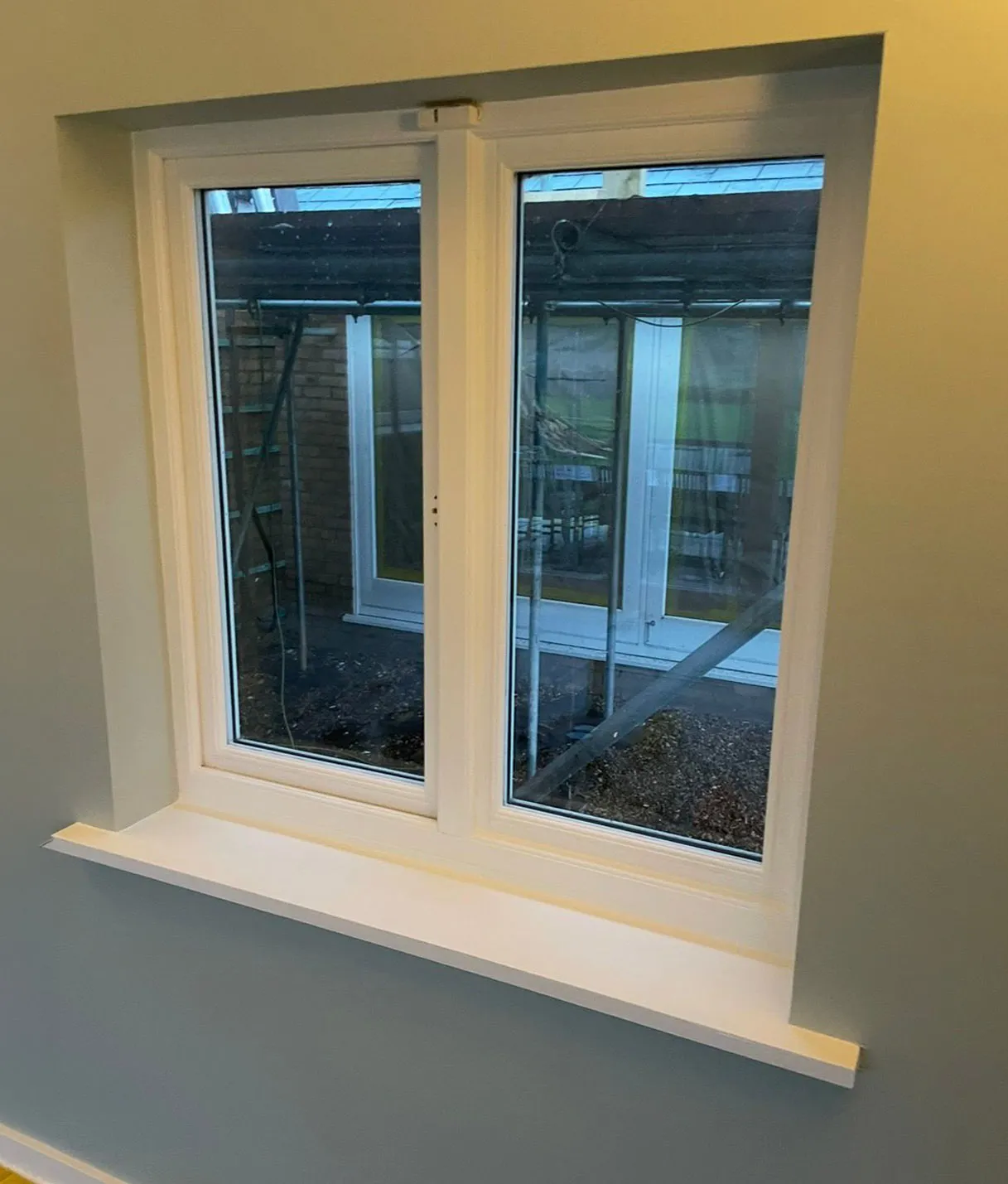 Freshly painted interior window frame and sill with flawless white finish